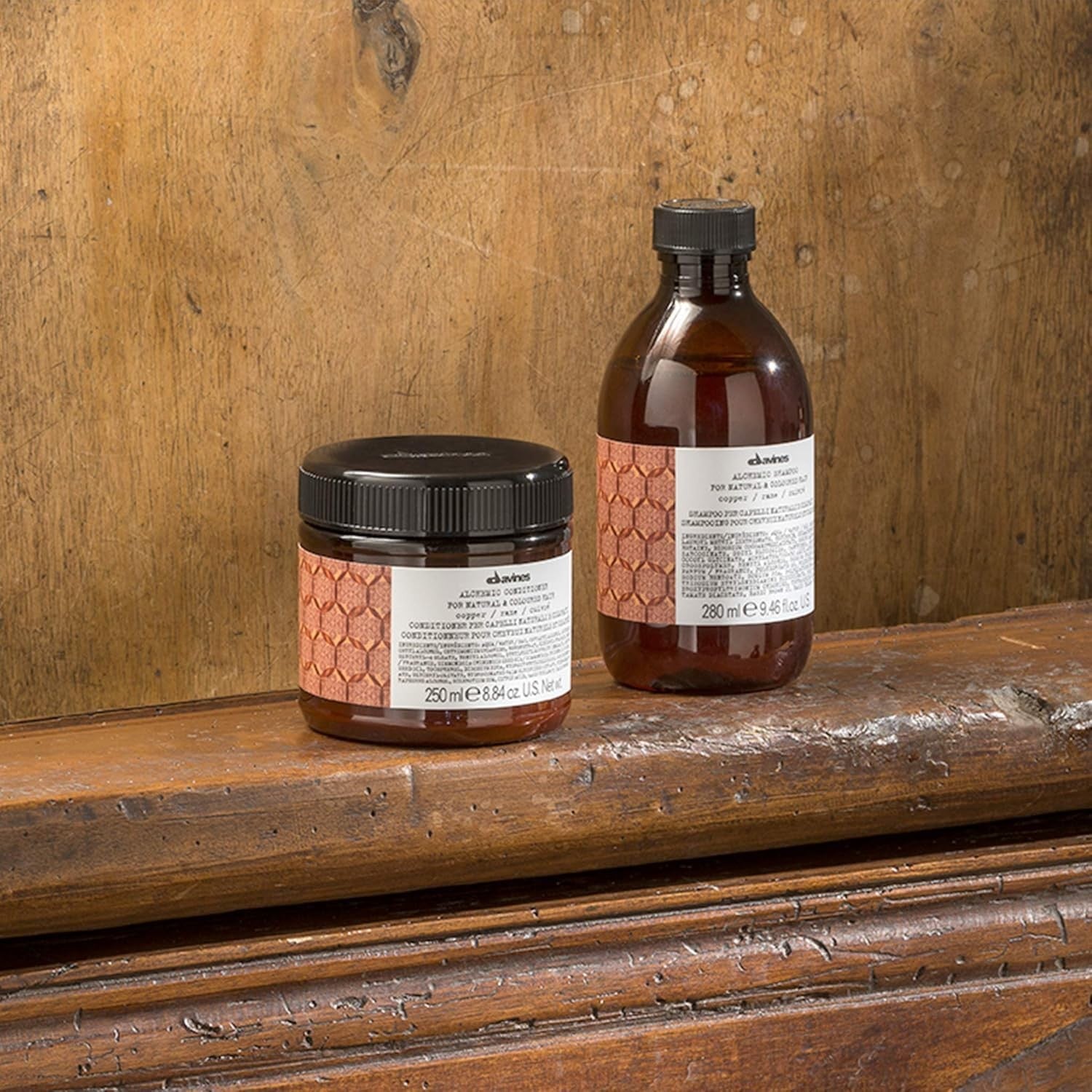 Davines Alchemic Copper Conditioner in 8.81 oz bottle, showing the product with copper-colored packaging and label.