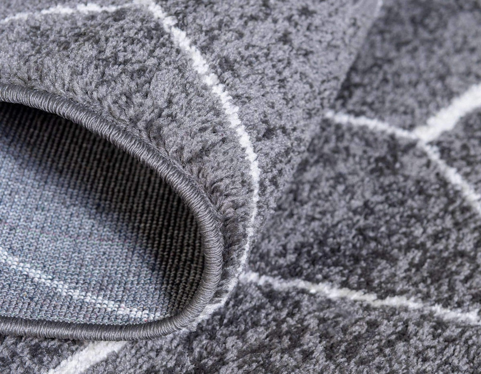 Unique Loom Trellis Frieze Collection area rug featuring geometric octagon pattern in dark gray, showcasing a modern design.