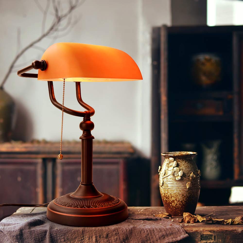 Newrays orange glass bankers desk lamp with pull chain switch and plug-in fixture, featuring a matte finish and vintage-style design.