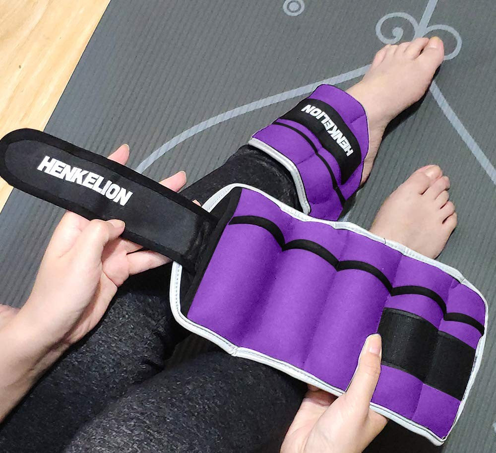 Pair of adjustable 10 lbs ankle weights for women, men, and kids, shown lying flat with straps and weight plates visible.