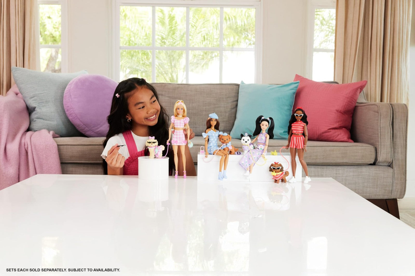 Barbie Twinning Looks doll and pet dog in matching purple daisy outfits, showcasing coordinated fashion and accessories.