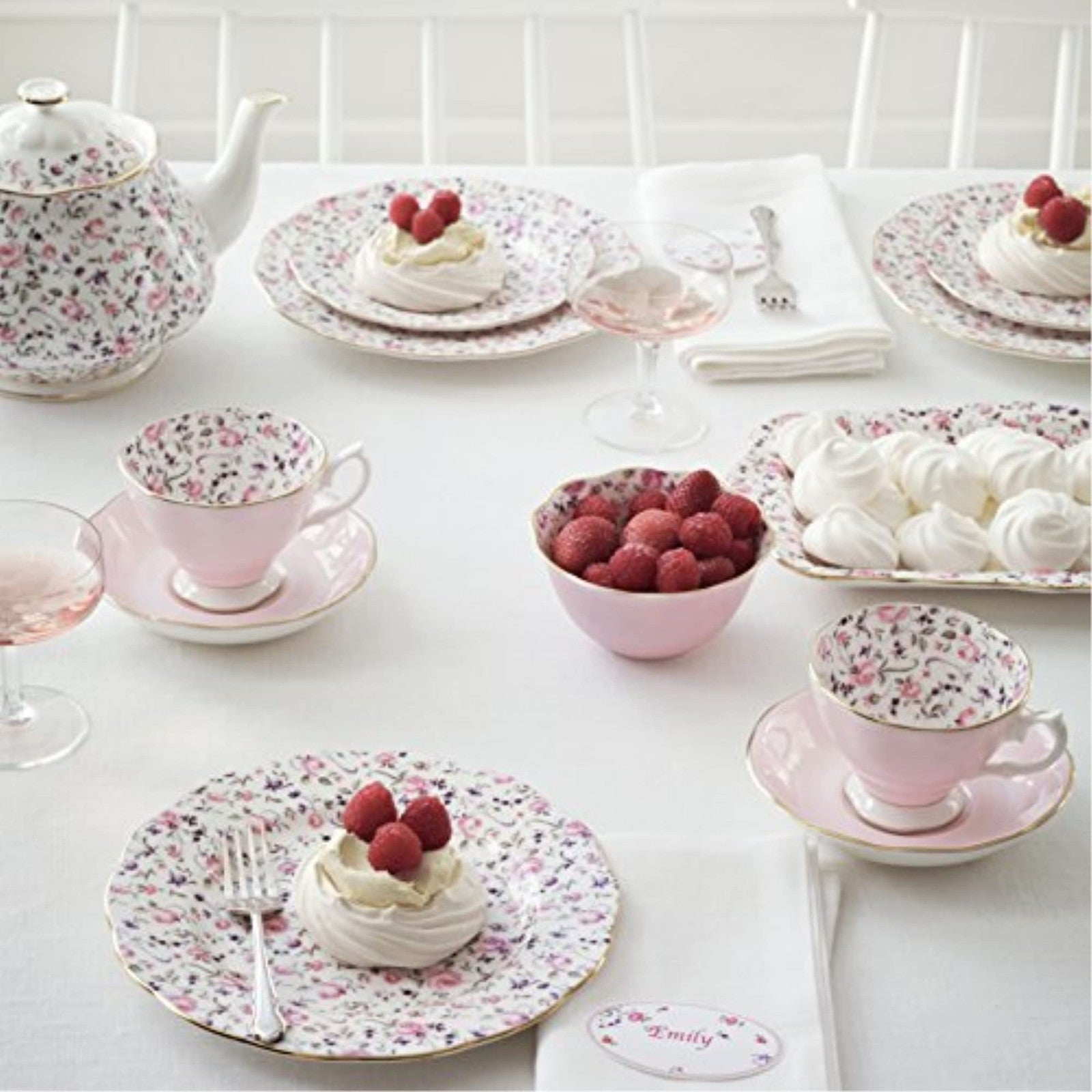 Royal Albert Rose Confetti teacup and saucer set with floral pattern and delicate gold accents on white porcelain.