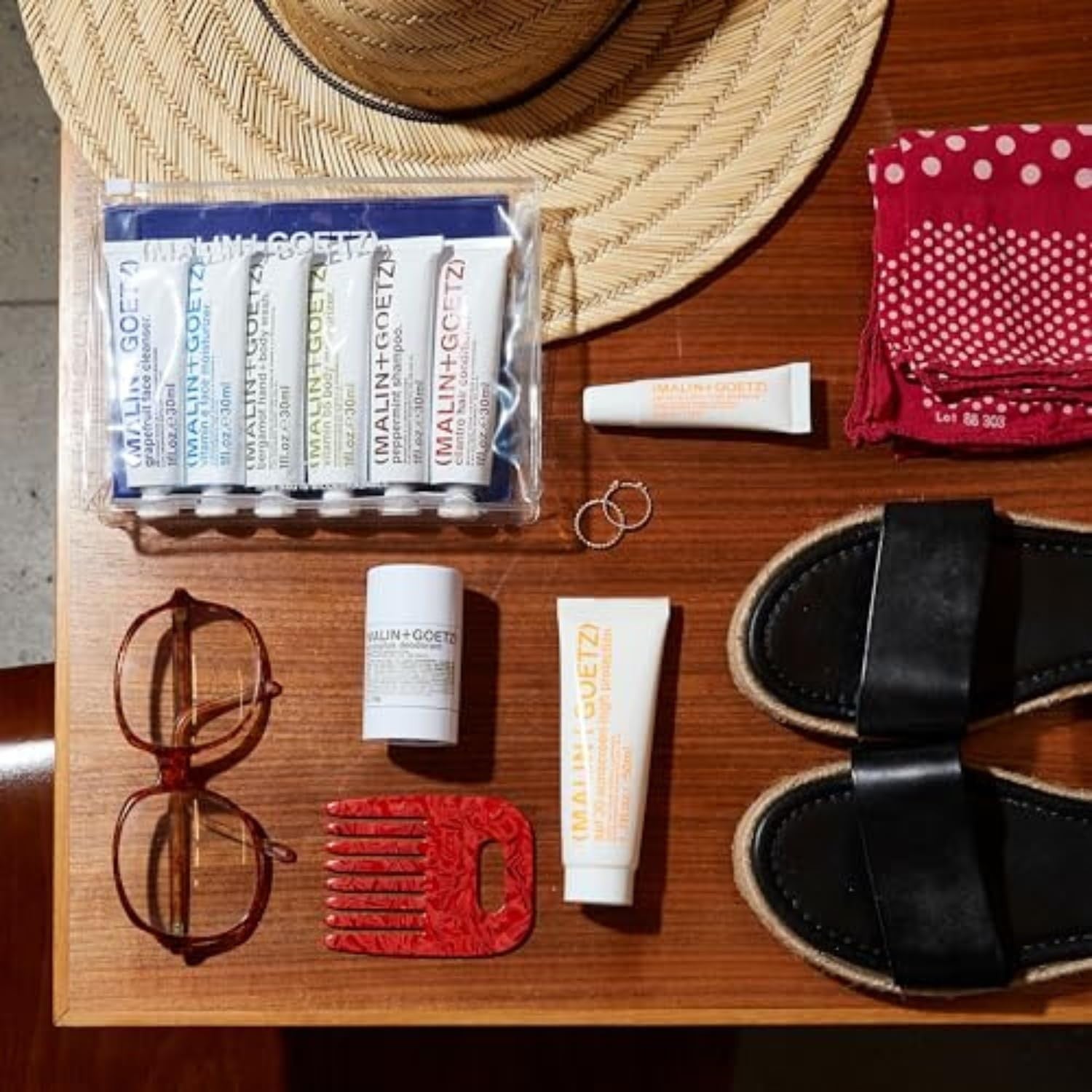 MALIN+GOETZ SPF 30 mineral sunscreen tube, broad spectrum face and body sun protection with lightweight, natural finish.