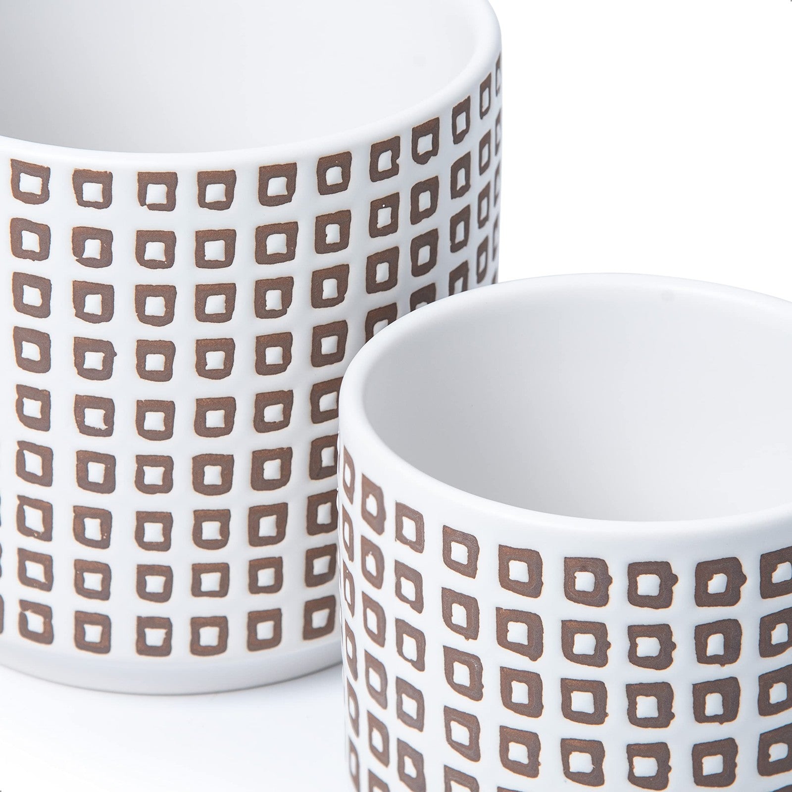 Pair of 6-inch D'vine Dev ceramic planter pots with drainage holes and saucers, ideal for indoor plants and decorative gardening.