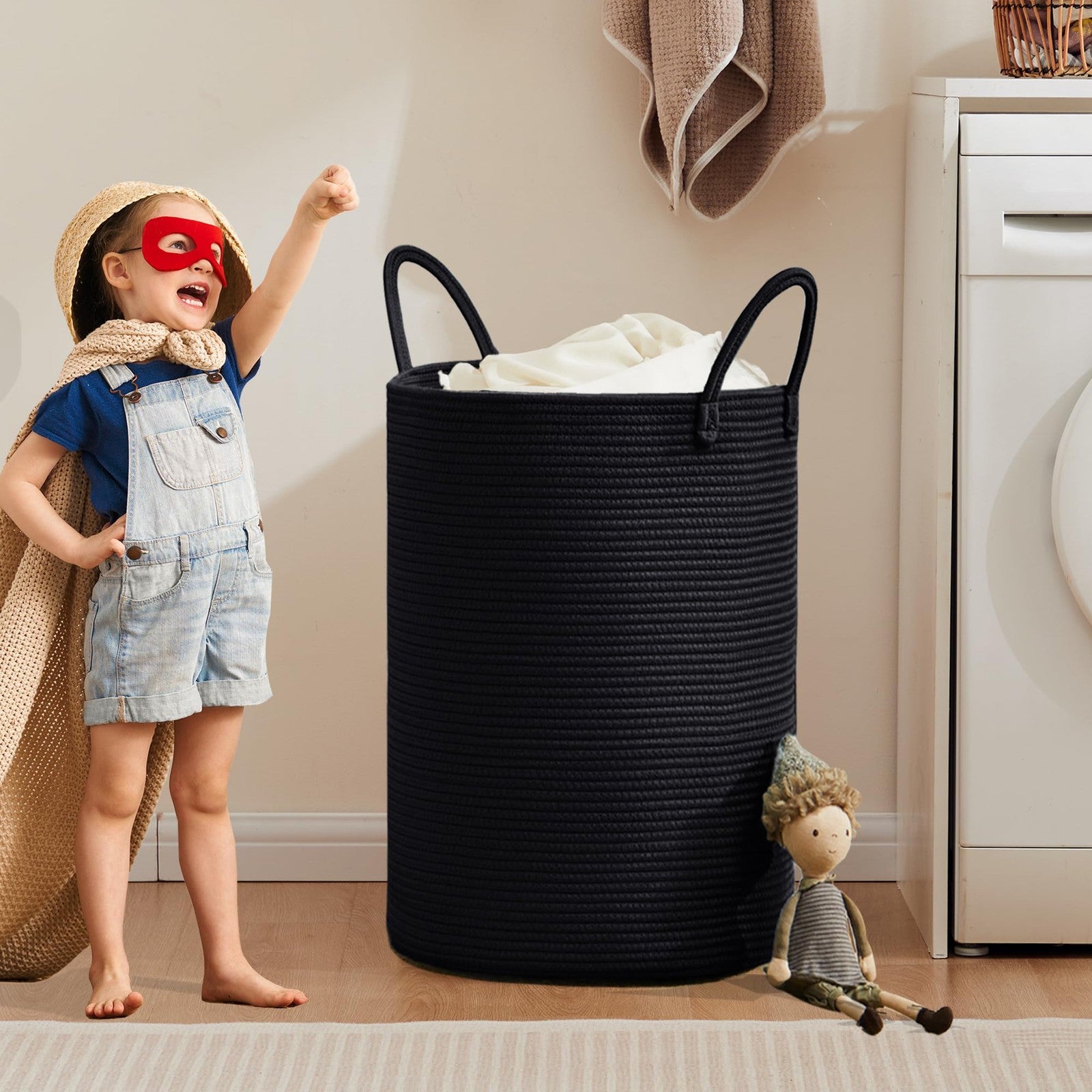 MOJOSCEND 80L black woven rope laundry hamper with tall, modern design and sturdy construction for clothes storage.