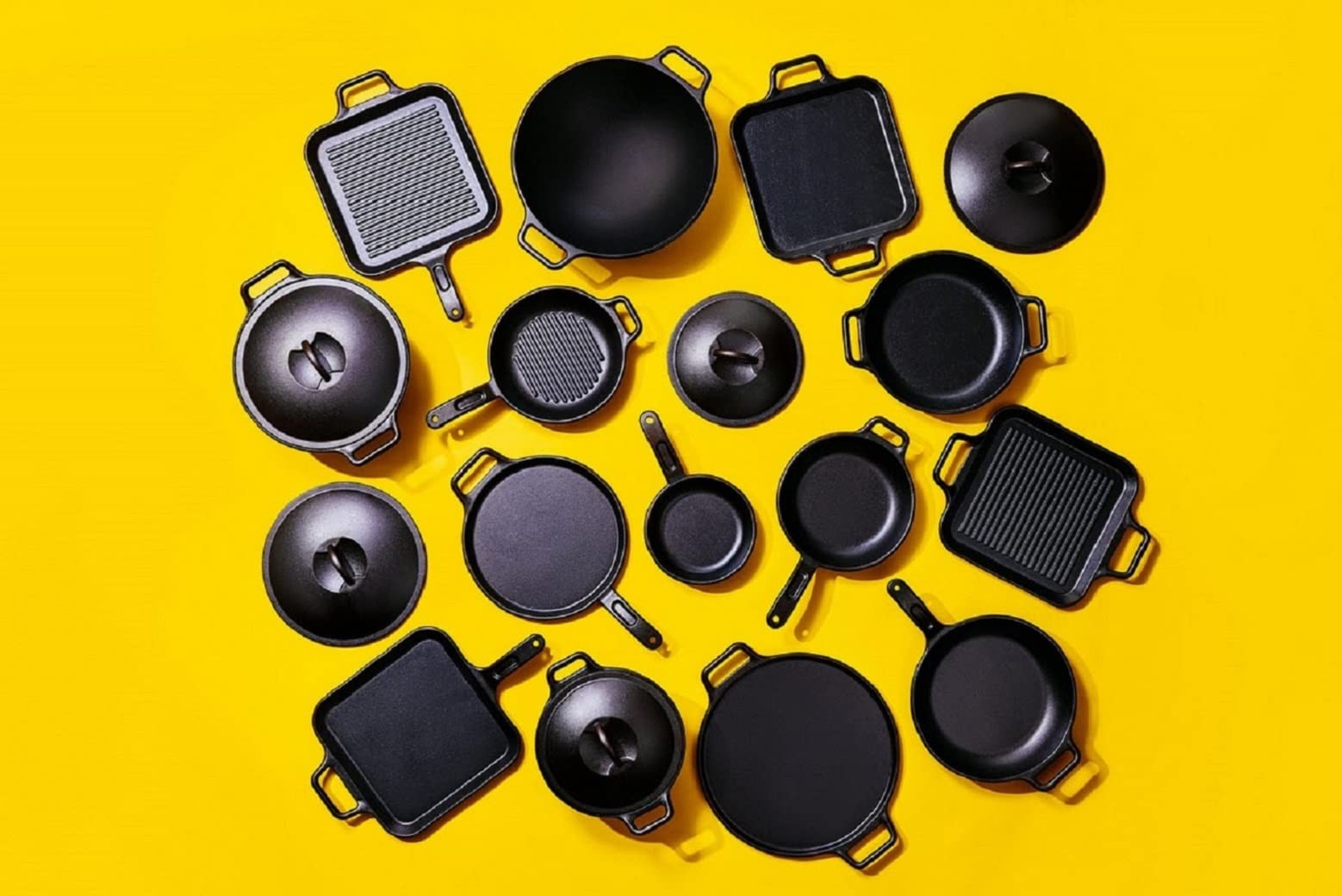 Lodge BOLD pre-seasoned cast iron lid on a skillet, showcasing durable, black cast iron cookware for grilling and cooking.