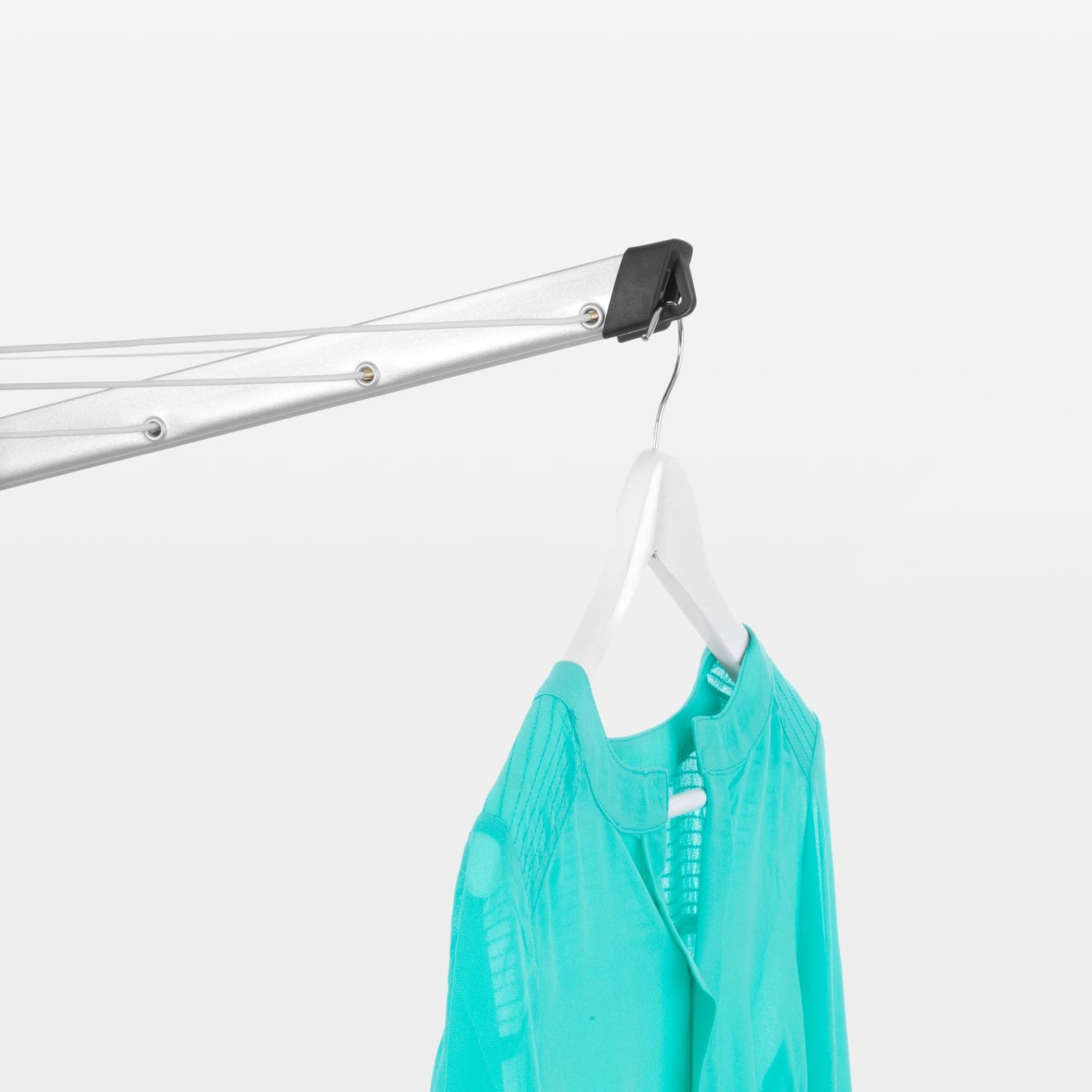 Brabantia Topspinner outdoor clothesline with 4 arms, 197ft drying space, rotating and foldable for outdoor laundry drying.