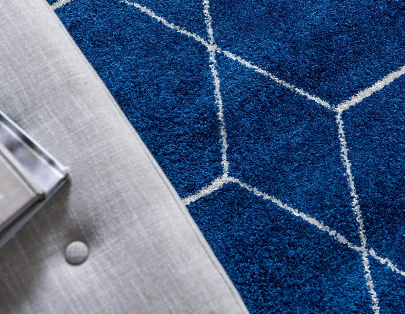 Unique Loom Trellis Frieze Collection area rug featuring a navy blue geometric trellis pattern on a square rug.