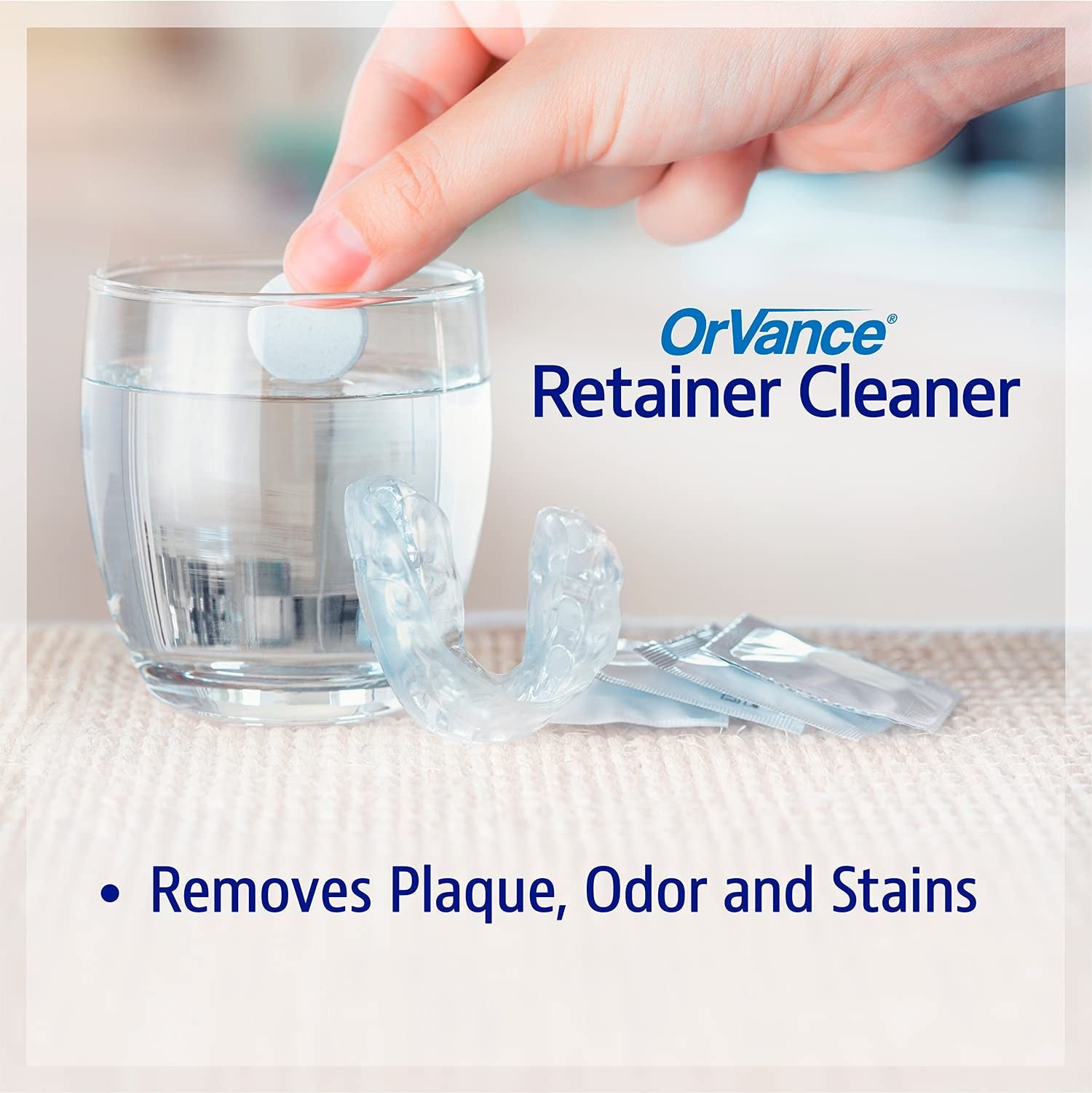 Unbranded Orvance retainer cleaner tablets, one-year supply, showing packaging and cleaning tablets for maintaining dental retainers.