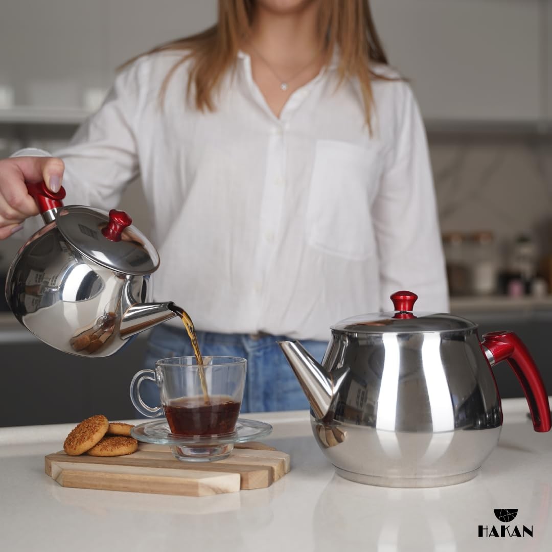 Hakan 93 oz stainless steel teapot set with double lids and built-in strainer, featuring a sleek, modern design.