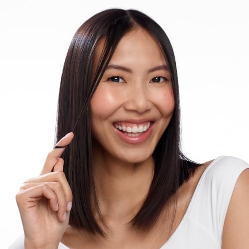 Nioxin Age Defense Anti-Aging Hair Serum in a clear bottle, leave-in scalp treatment with peptides for aging hair care.