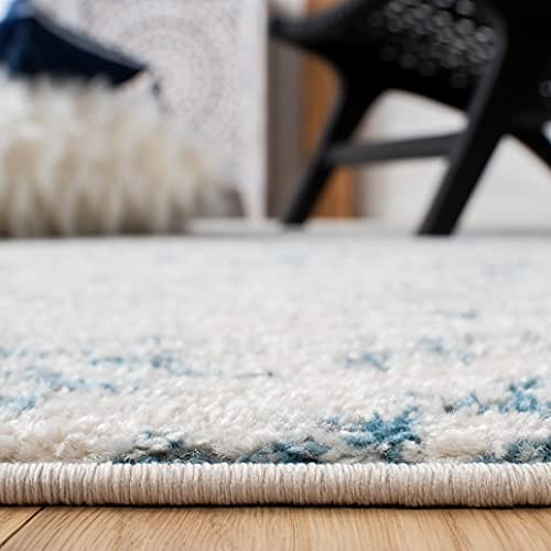 Safavieh Tulum Collection 6x9 ivory and turquoise Moroccan boho tribal area rug with geometric patterns and tribal motifs.