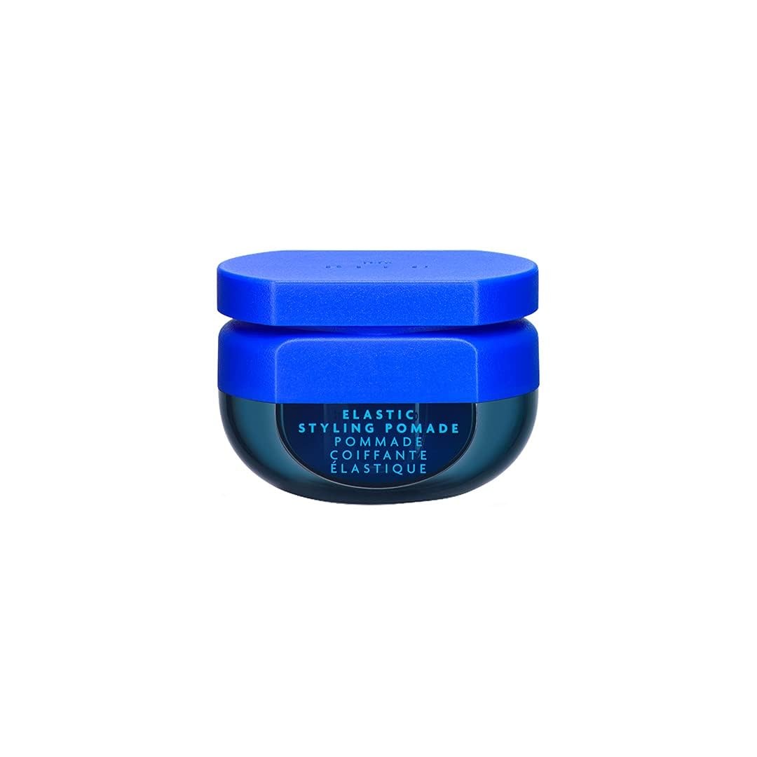 R+Co BLEU Elastic Styling Pomade showing textured hair with defined separation and structure for a piecey, styled look.
