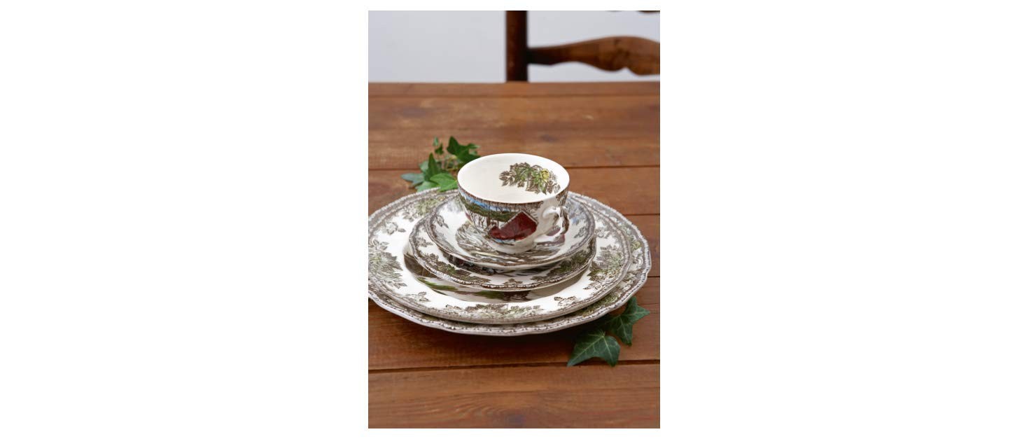 Johnson Brothers Friendly Village 20-piece dinnerware set with multicolor farm scene designs, including plates, bowls, and mugs.