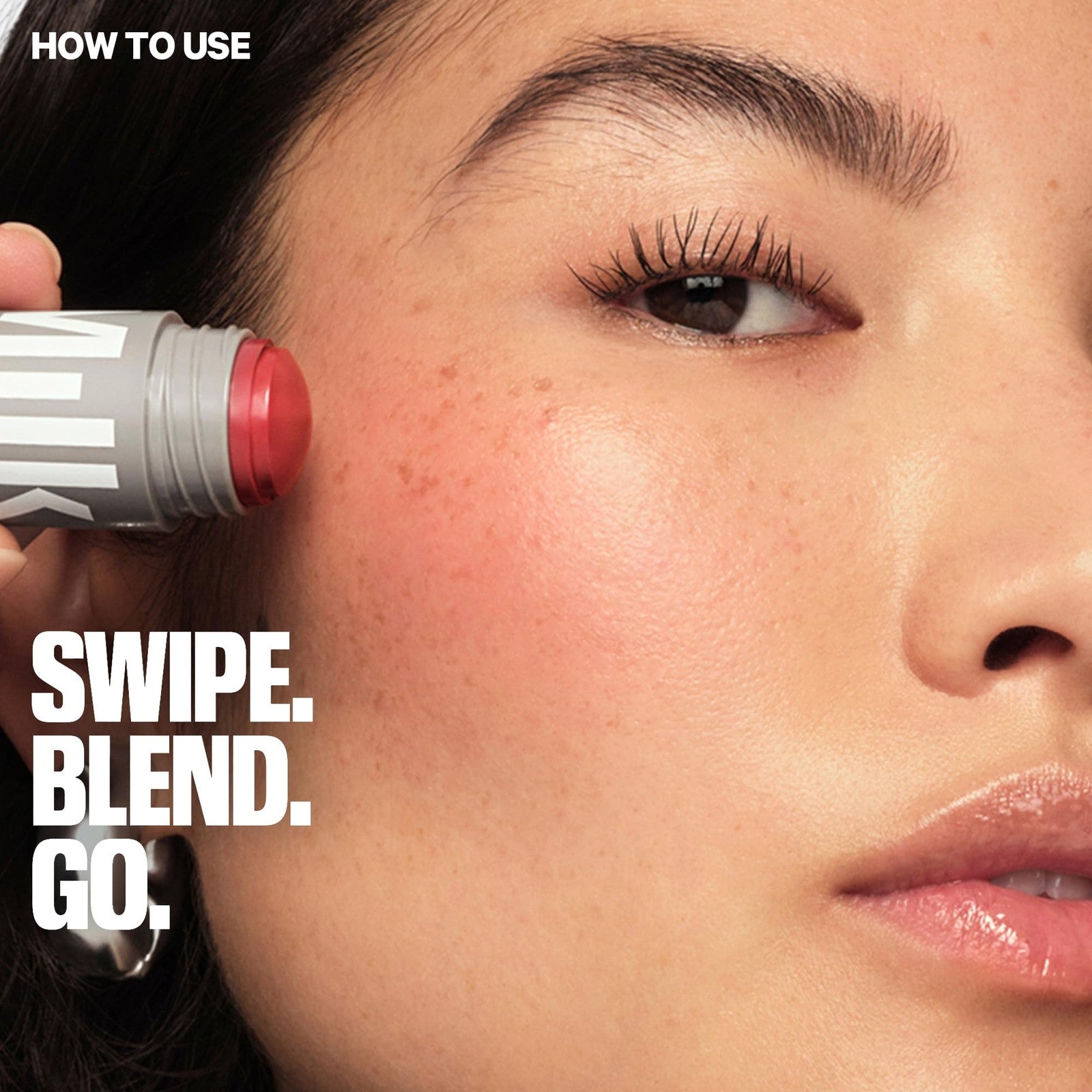 Milk Makeup Lip Cheek Stick with buildable cream blush and hydrating mango, shown with the product open and swatched.