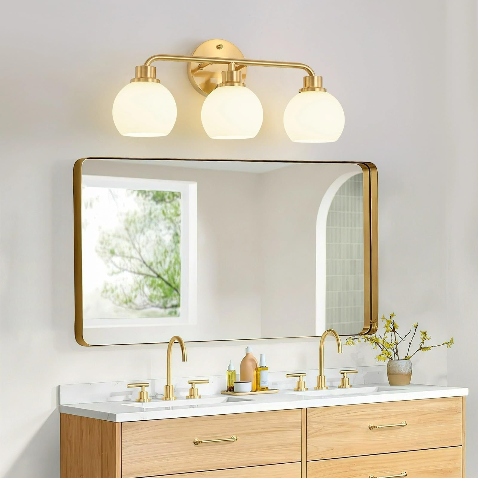 Watyo gold bathroom vanity light fixture with three wall sconce lights and modern design for bathroom lighting.