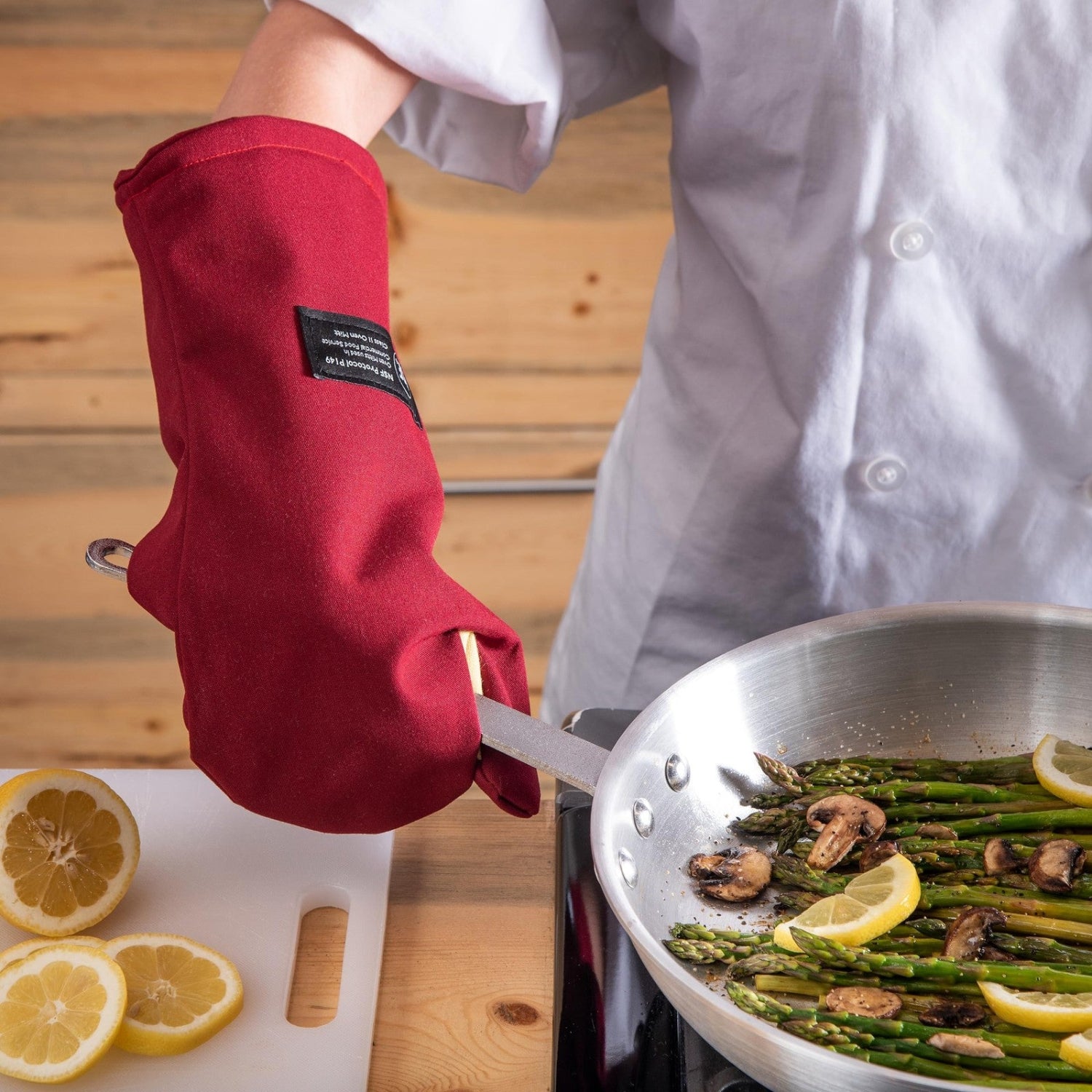 San Jamar KT0215 Cool Touch Flame conventional high heat intermittent flame protector in use, designed for safety in commercial kitchens.