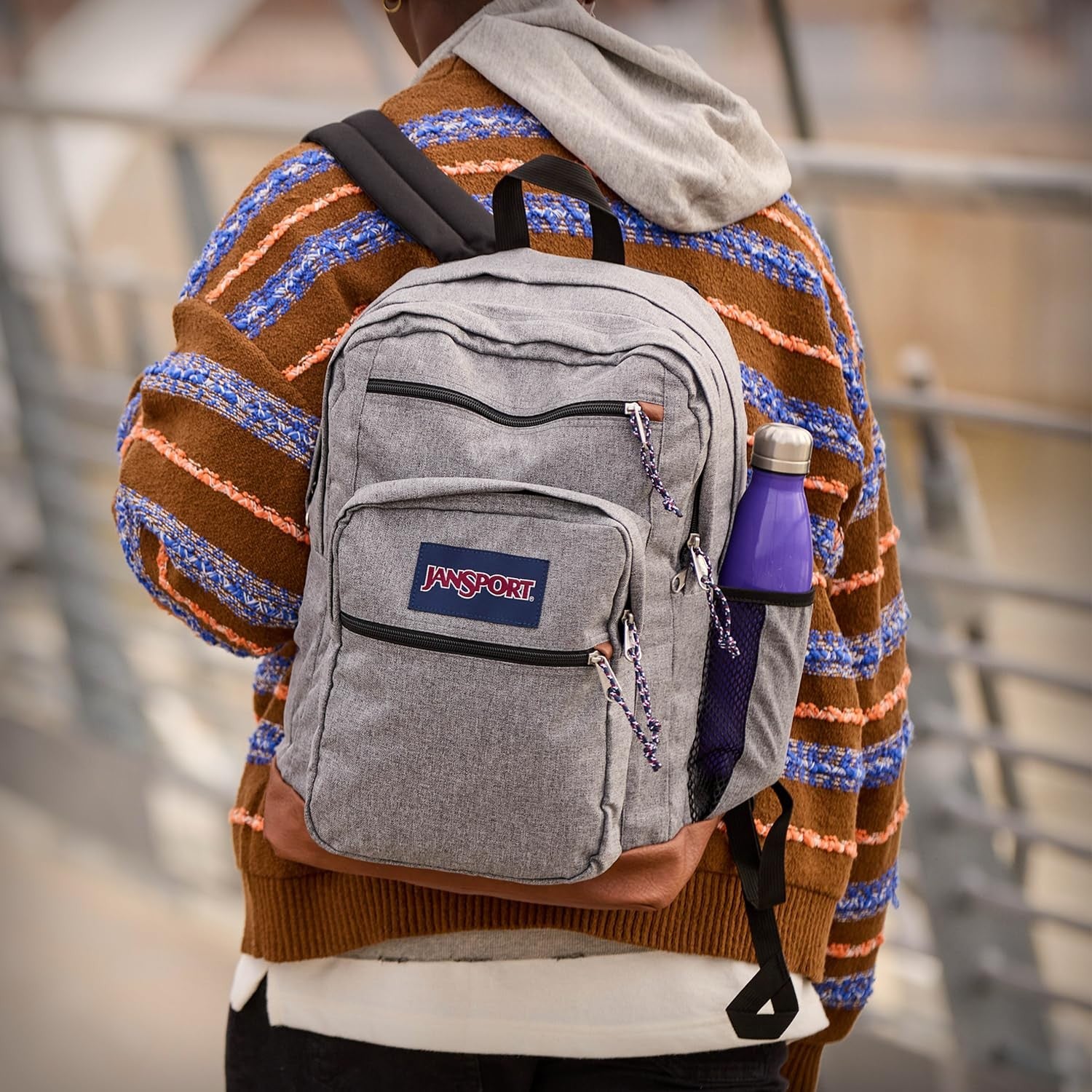 JanSport cool backpack with 15-inch laptop sleeve, large computer rucksack featuring multiple compartments and padded straps.