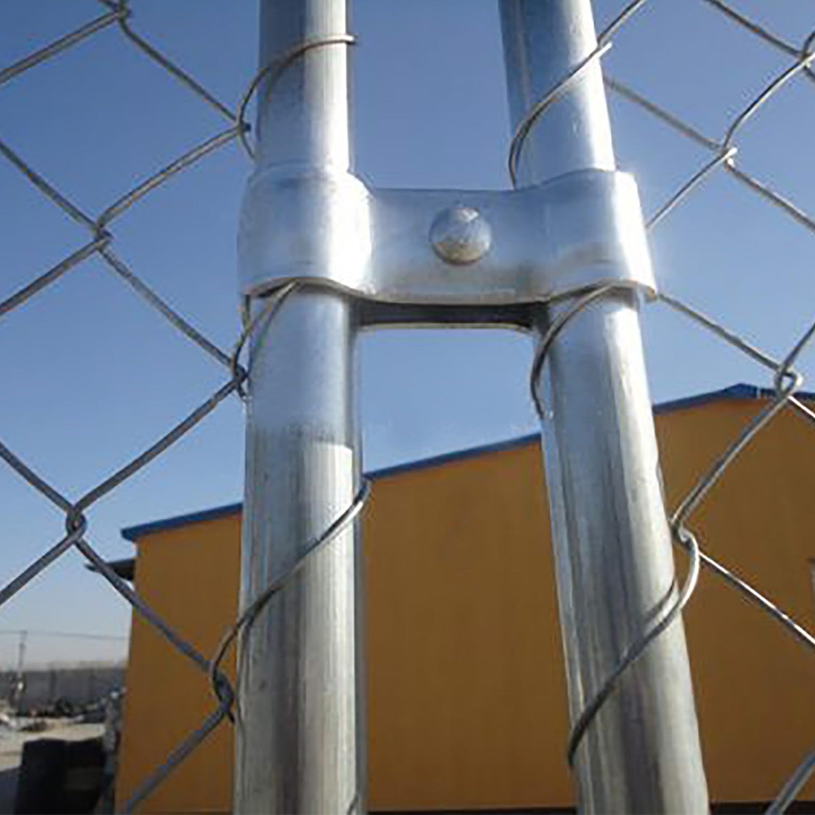 Set of 18 galvanized chain link fence panel clamps for dog kennels, 1-3/8 inch size, sturdy and rust-resistant for secure fencing.