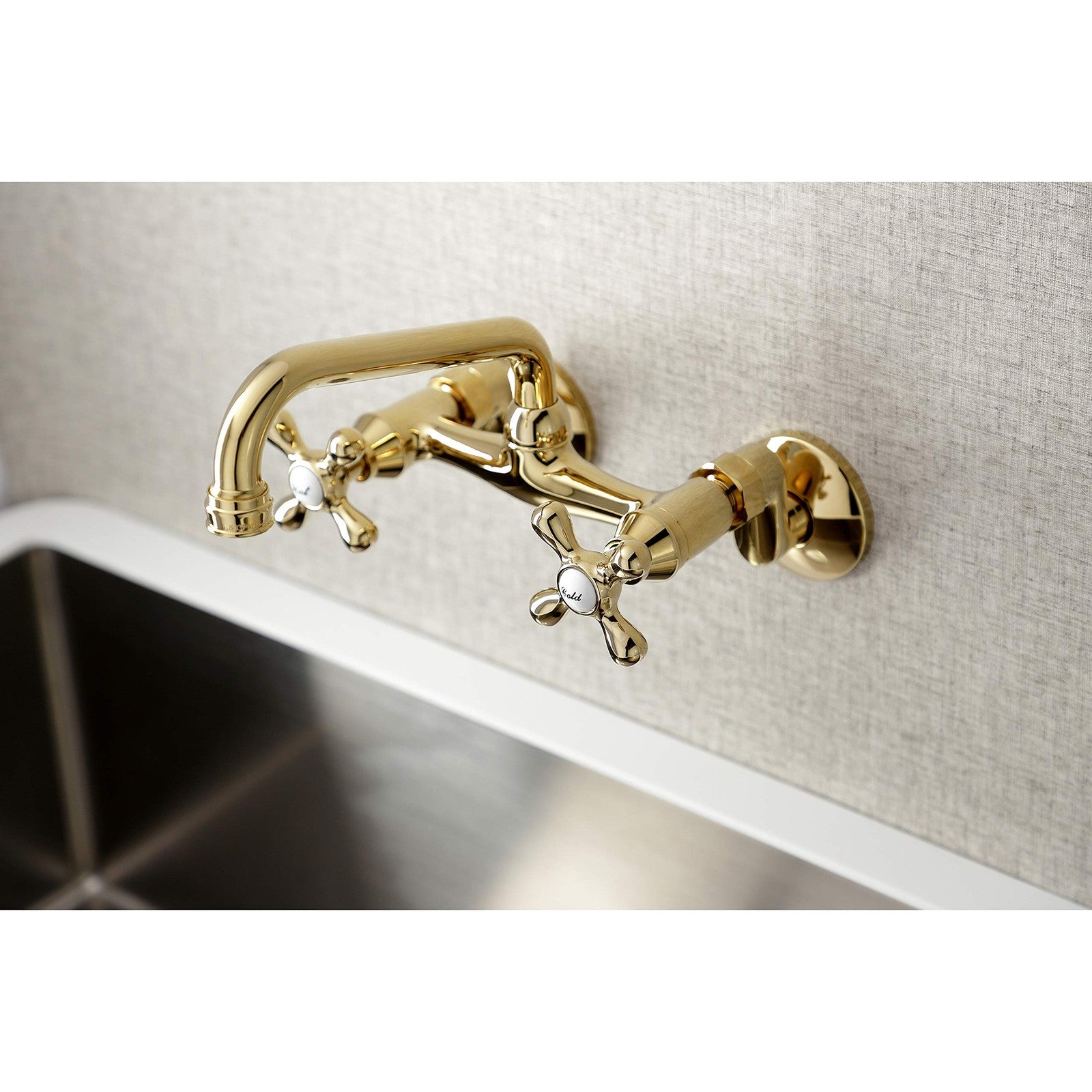 Kingston Brass Victorian two-handle wall mount kitchen faucet with 7-inch spout and polished finish, featuring classic Victorian design.