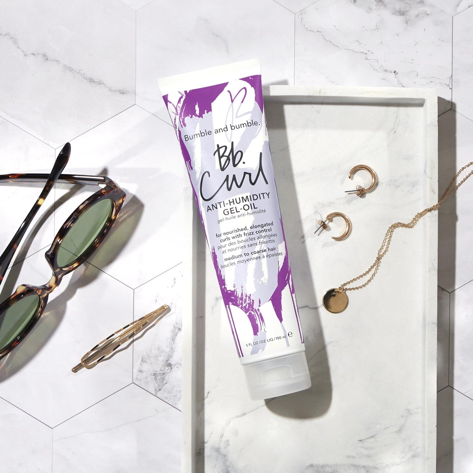 Bumble and bumble Curl Anti-Humidity Gel-Oil for coily and curly hair, showing the product bottle with a pump dispenser.