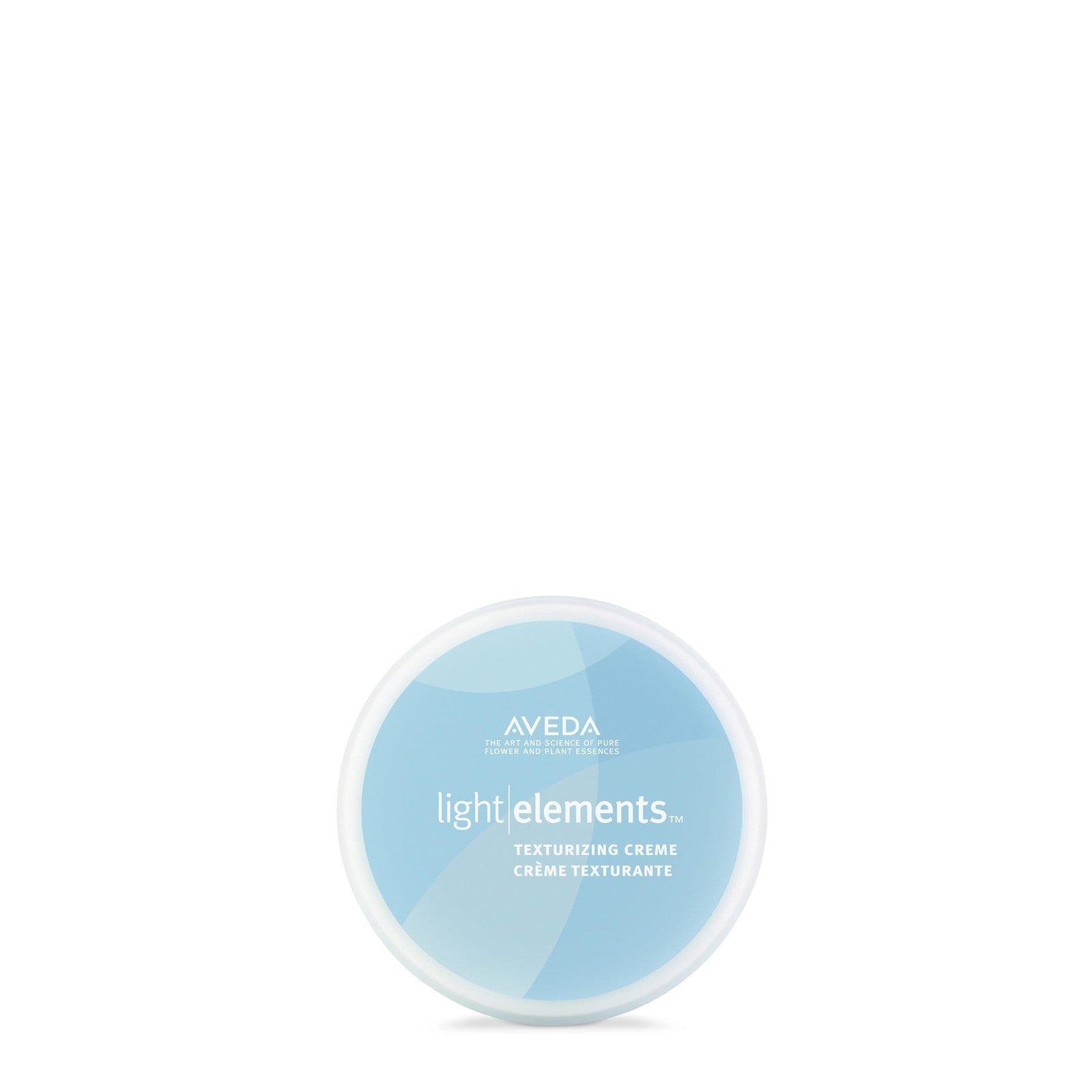 Aveda Light Elements Texturizing Creme for all hair types, showing the product jar with a natural hairstyle and textured look.
