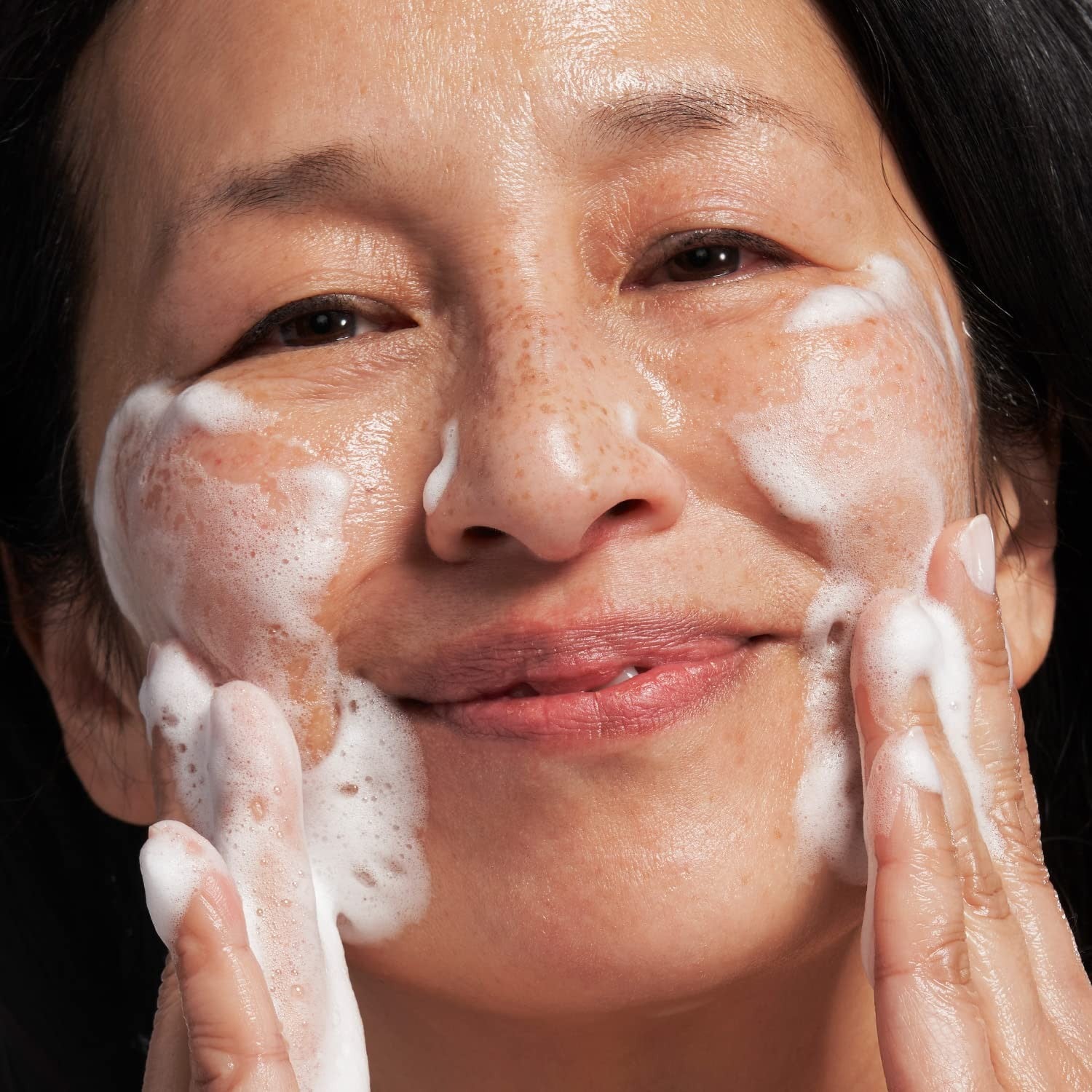 NEOSTRATA Exfoliating Wash Revitalizing Foaming Facial Cleanser with Polyhydroxy, showing the product bottle and label.
