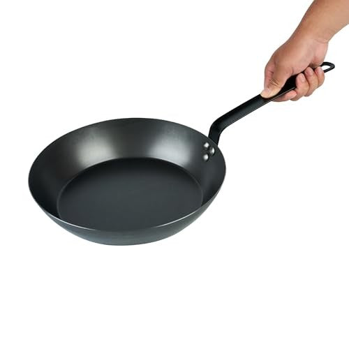 Restaurantware Met Lux 12-inch lightweight frying pan with triple-rive induction-ready surface, shown on a stovetop.