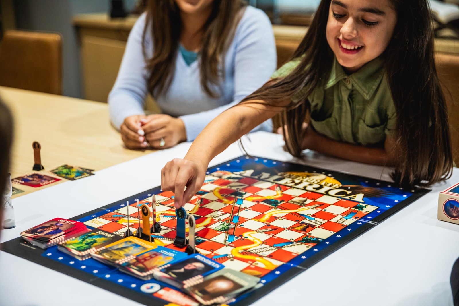 PragerU Celebrate America Race to The White House trivia board game with colorful game pieces and a game board featuring USA-themed graphics.