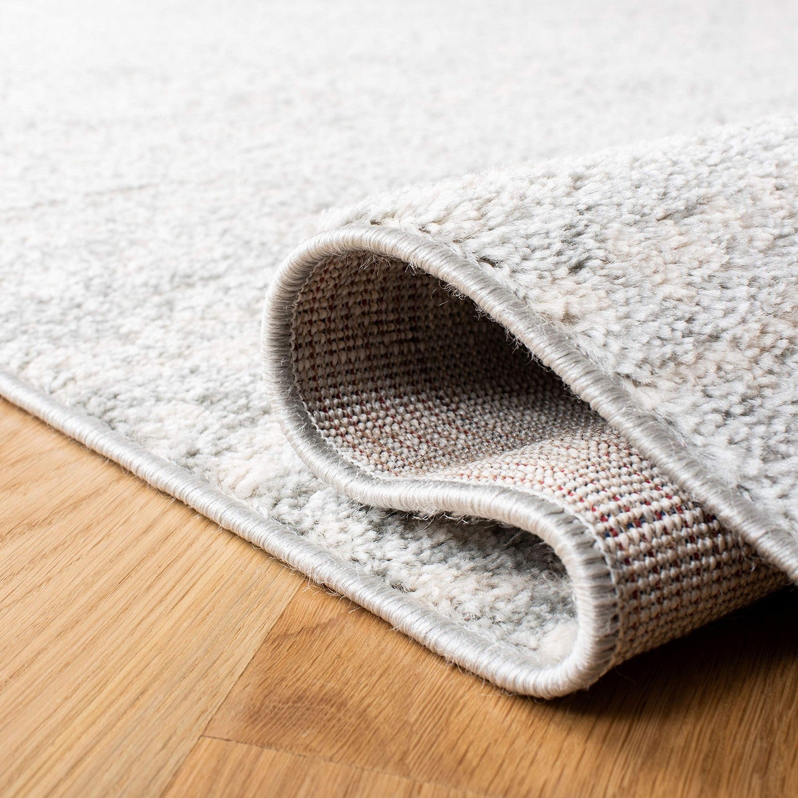 Safavieh Tulum Collection accent rug in light grey and ivory with Moroccan boho design, 2x5 feet, plush and stylish.