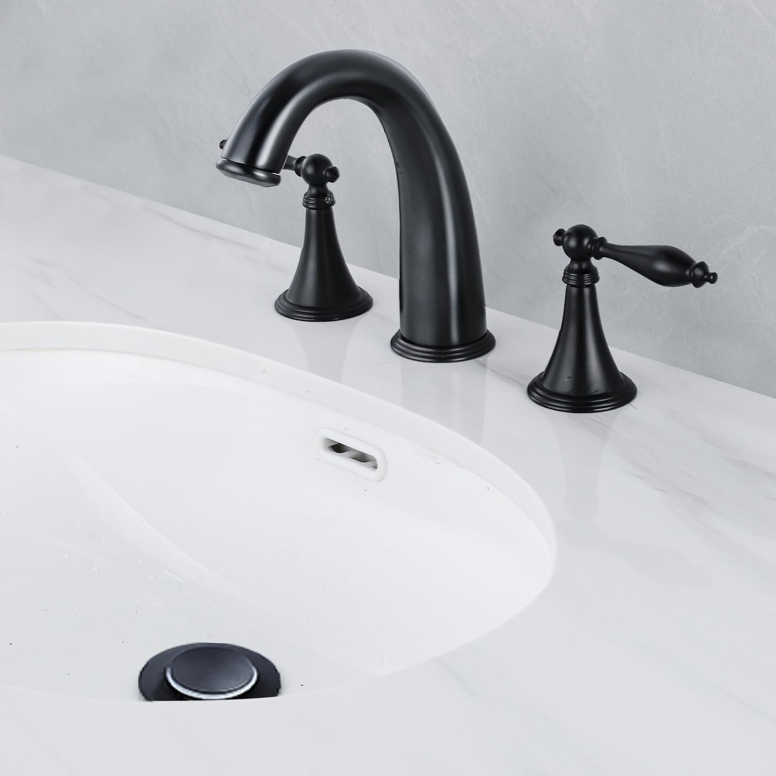 SaniteModar black brass bathroom sink faucet with widespread design, modern style, and sleek finish.
