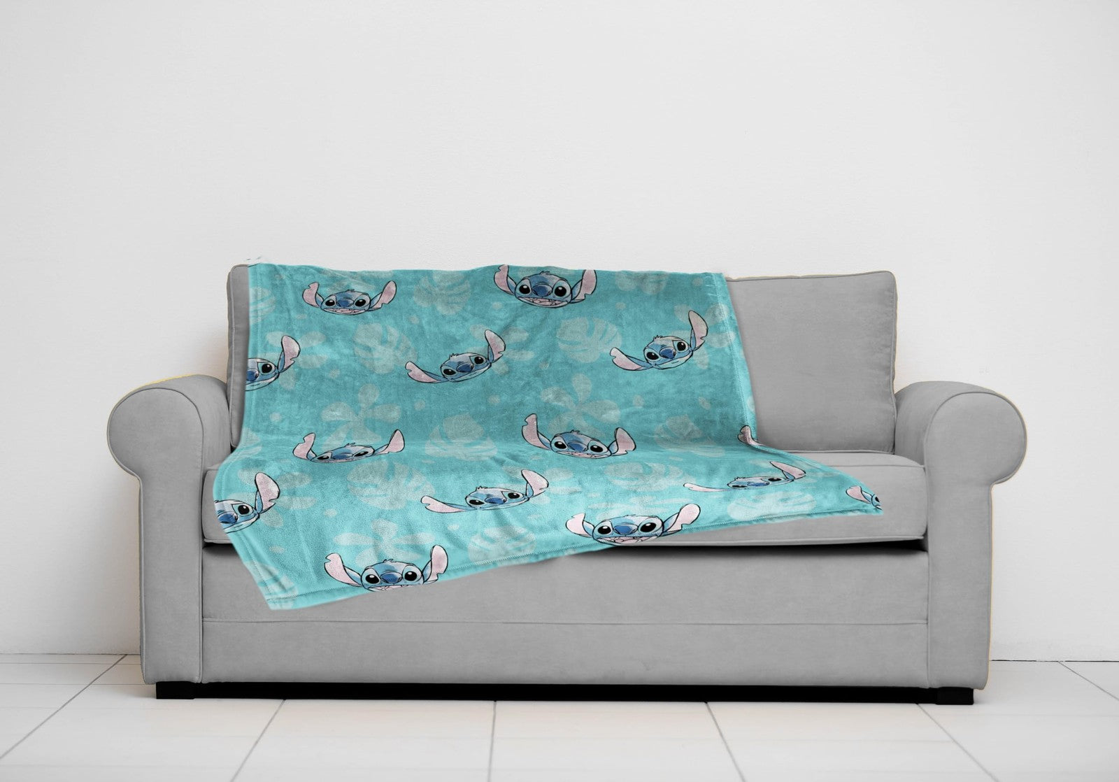 Jay Franco Lilo & Stitch plush fleece throw blanket featuring cartoon Stitch design, 46x60 inches, cozy and soft for kids.