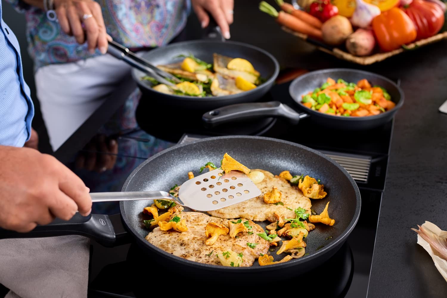 Rösle stainless steel perforated turner spatula with 13-inch handle, featuring a perforated flat surface for turning and lifting food.