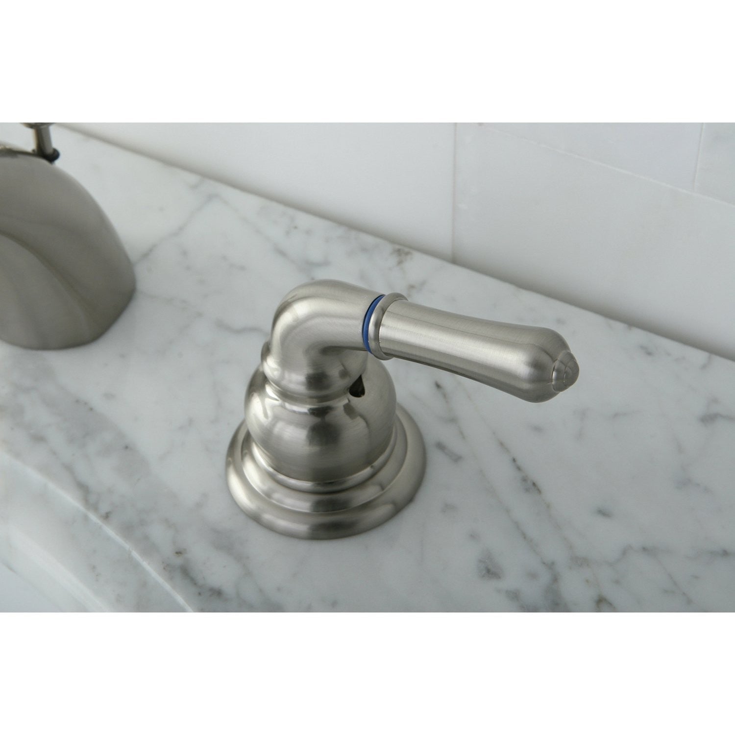 Kingston Brass KB958KL mini-widespread bathroom faucet with brushed nickel finish, featuring sleek handles and modern design.