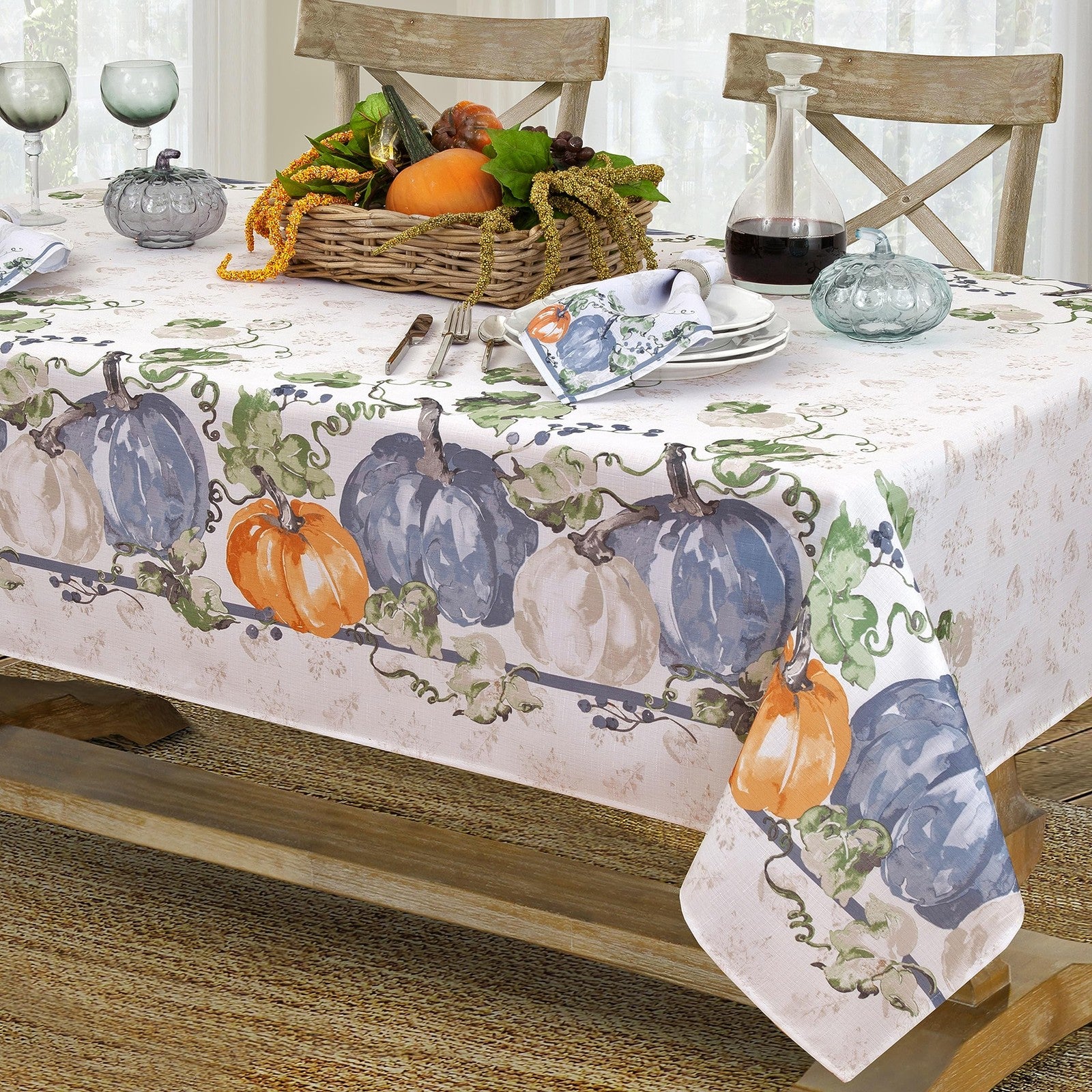 Newbridge Blue Pumpkin Vines stone-washed bordered tablecloth for Thanksgiving and fall season, featuring pumpkin and vine design.