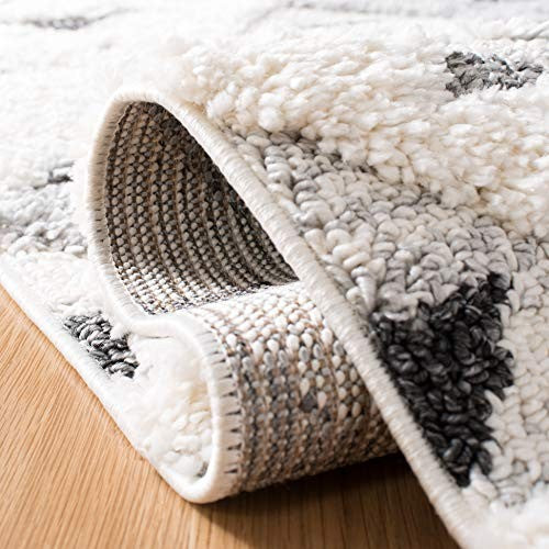 Safavieh Moroccan Tassel Shag Collection round area rug featuring ivory and grey boho design with tassel details.