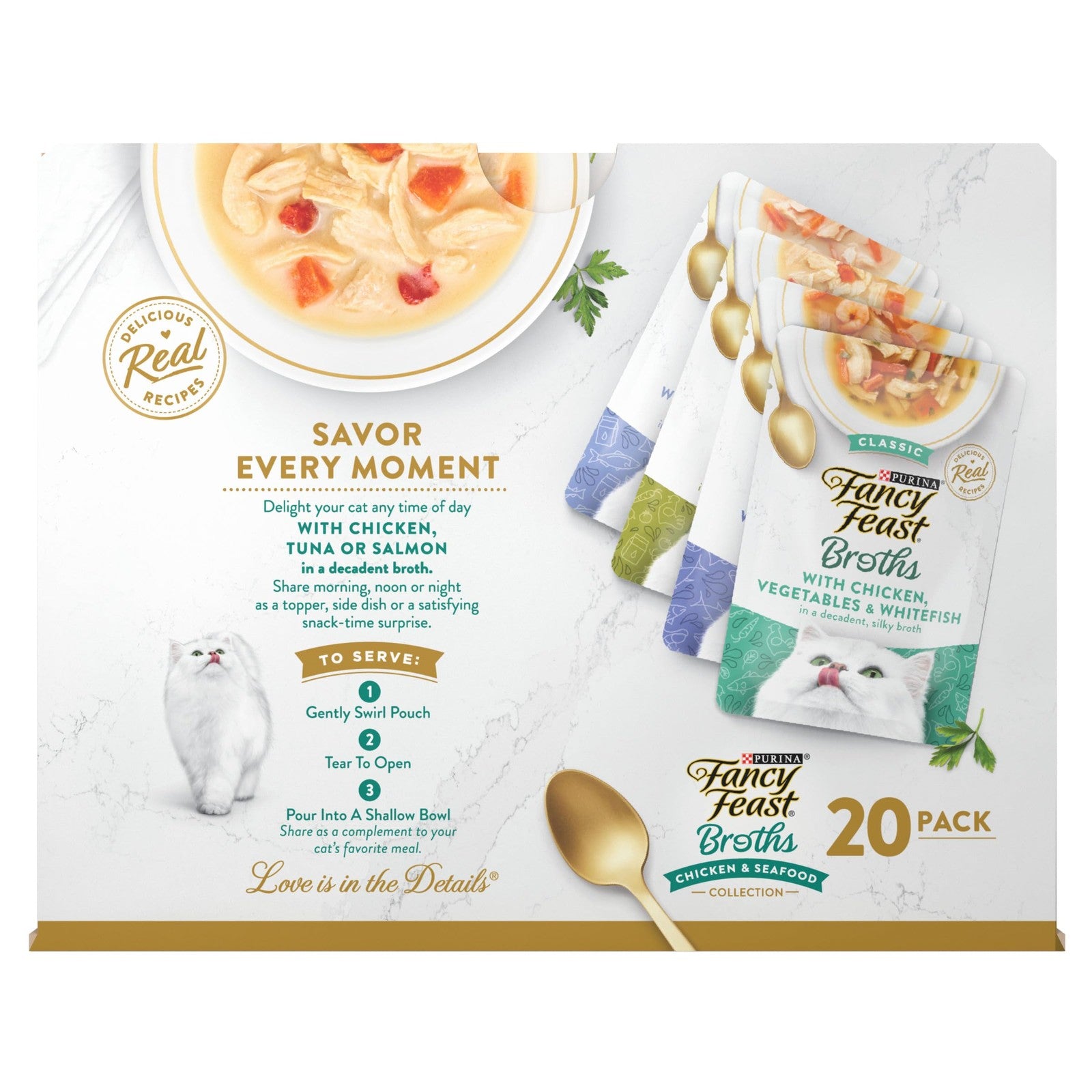 Fancy Feast Broth Complement Chicken & Seafood grain-free wet cat food in a bowl, showing the lickable, clear broth with seafood pieces.