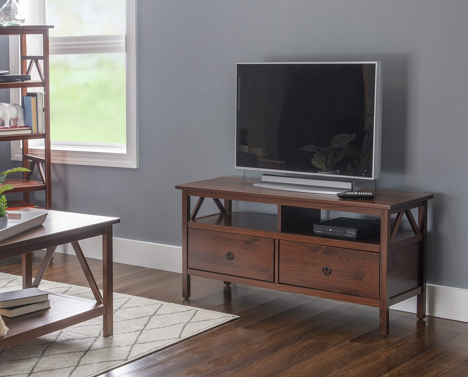 Linon Home Decor antique tobacco finish TV stand with 44-inch width, wooden storage and classic design.