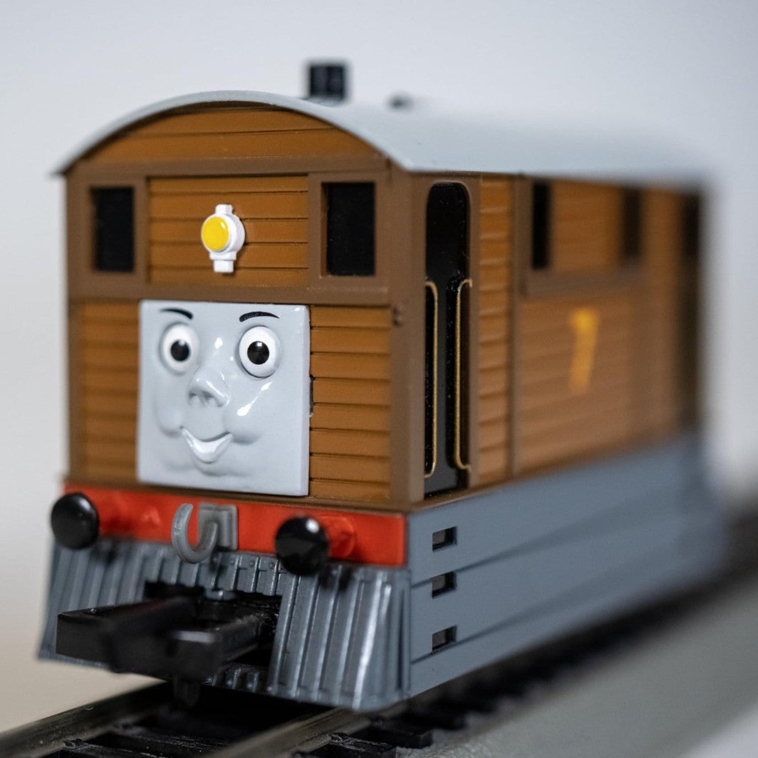 Bachmann Trains Thomas and Friends Toby the Tram Engine with moving eyes, black body, detailed model for train enthusiasts.