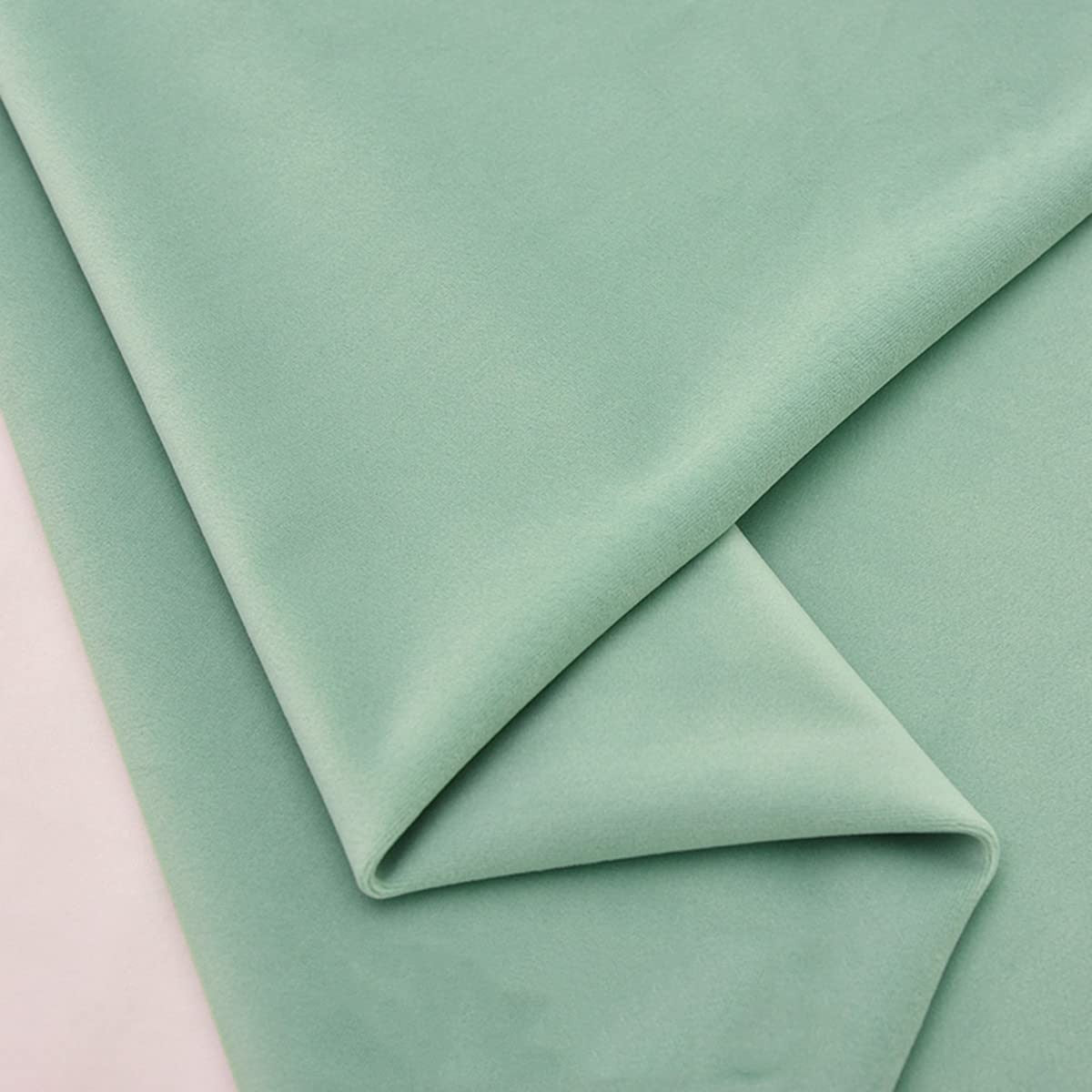 Light-colored velvet upholstery fabric by TinaKim, suitable for bench seat DIY repairs and upholstery projects.