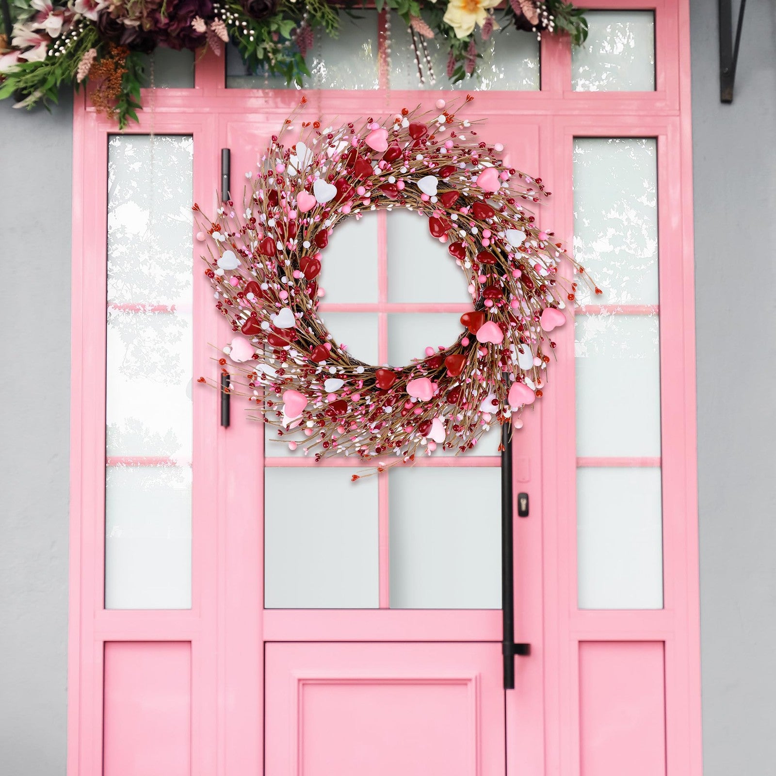 ANVAVO Valentine’s Day wreath with red, pink, and white hearts, berries, and artificial flowers in a 24-inch decorative arrangement