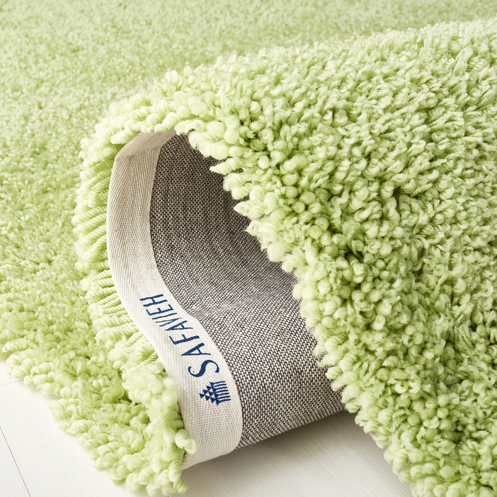 Safavieh Classic Shag 5x8 lime area rug with 1.75-inch thick plush handmade shag texture on a neutral floor