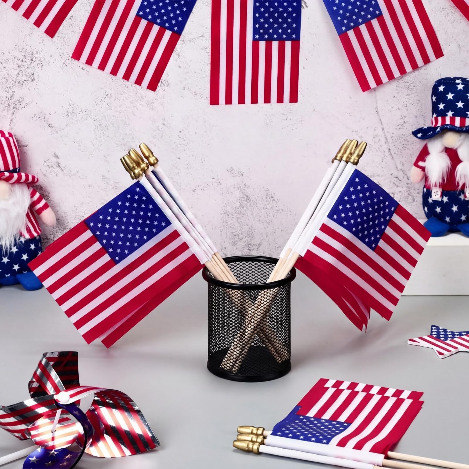 Tegeme small American flags on sticks, 4x6 inches, featuring gold accents, ideal for patriotic celebrations and events.