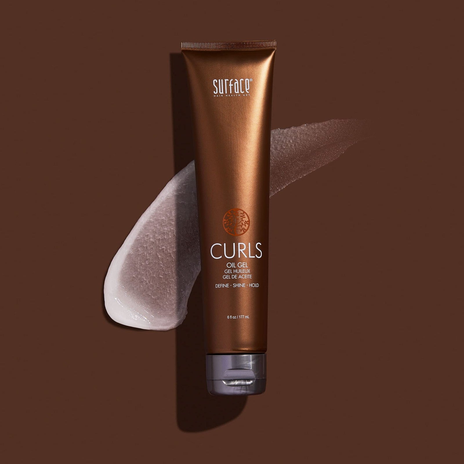 SURFACE Hair Curls Oil Gel applied to curly hair, providing shine, definition, and frizz control for a smooth, styled look.