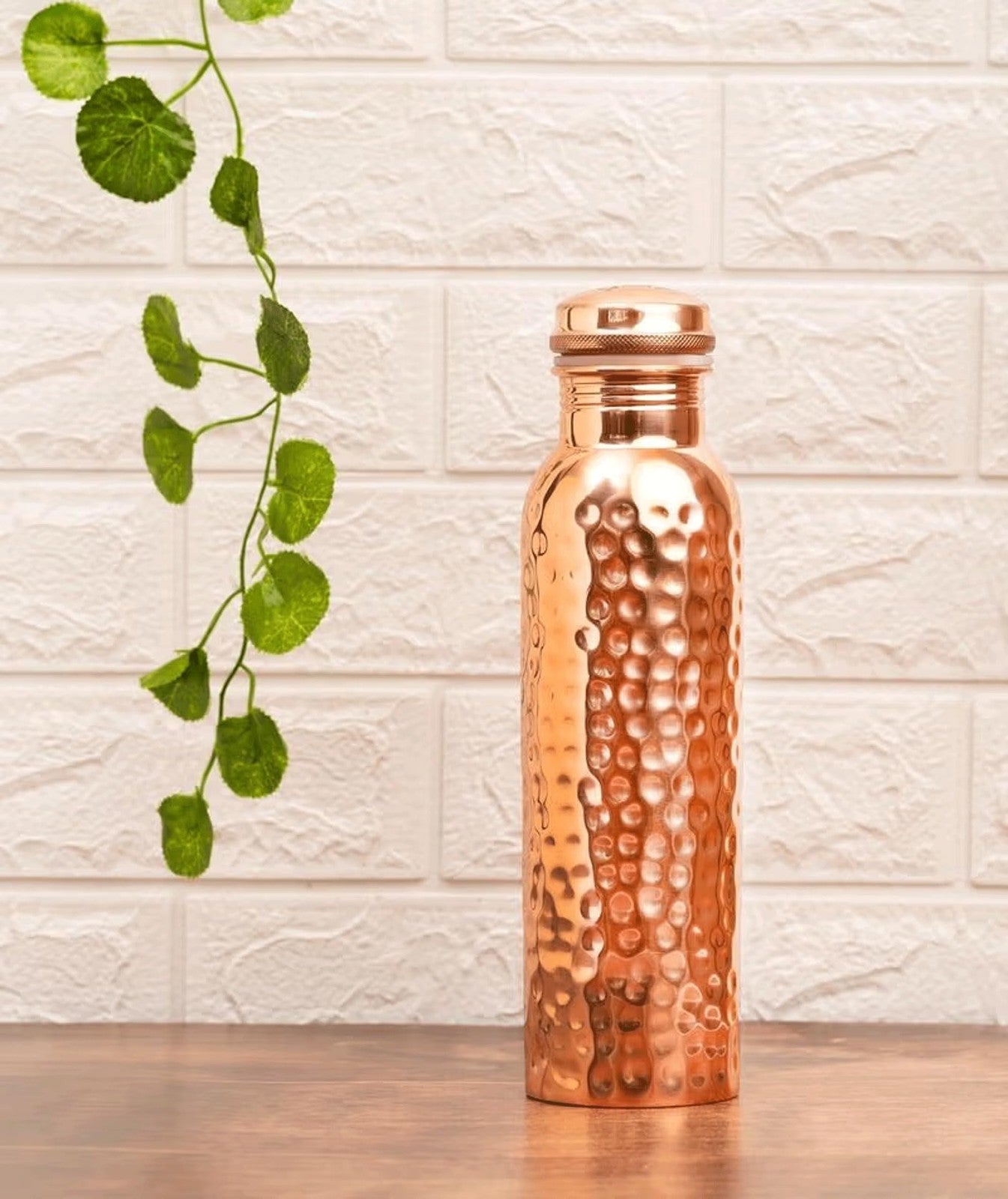 Hammered copper water bottle by Unbranded, traditional Ayurvedic pure copper vessel for storing and drinking water.