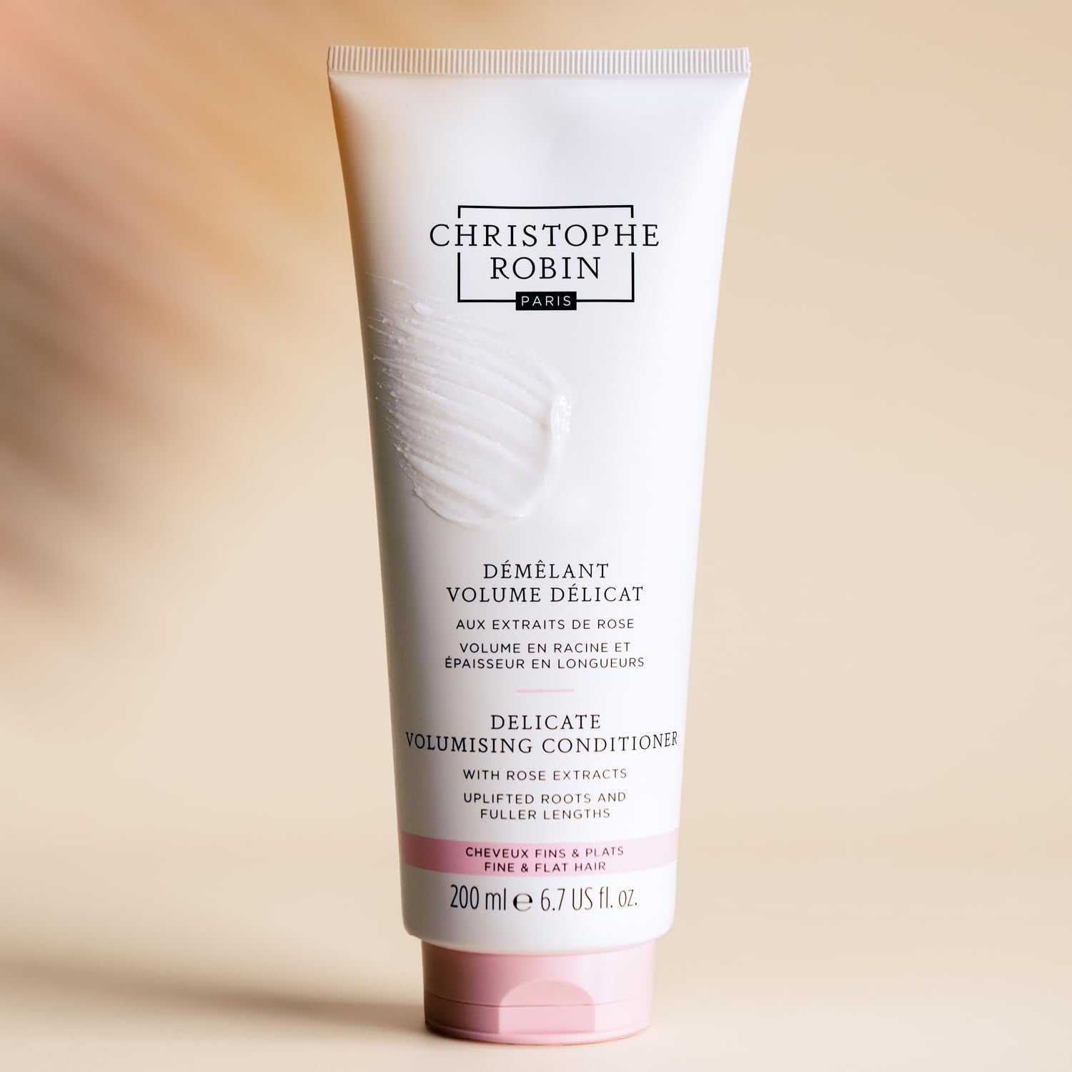Christophe Robin Delicate Volumizing Conditioner with Rose Extracts for thin, fine hair, showing the bottle with rose petals in the image