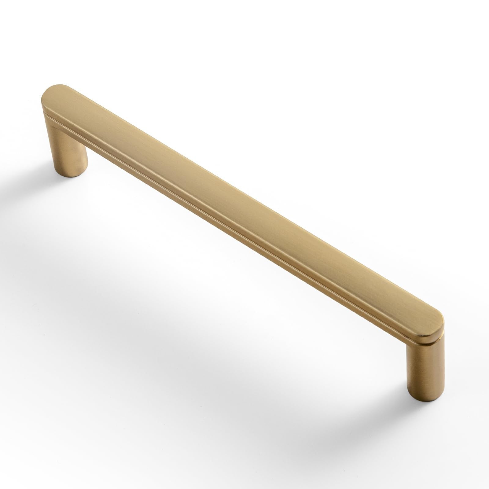 Goo-Ki 6-pack 5-inch champagne bronze cabinet pull handles with decorative grooved T-shaped design, mounted on wood cabinetry.