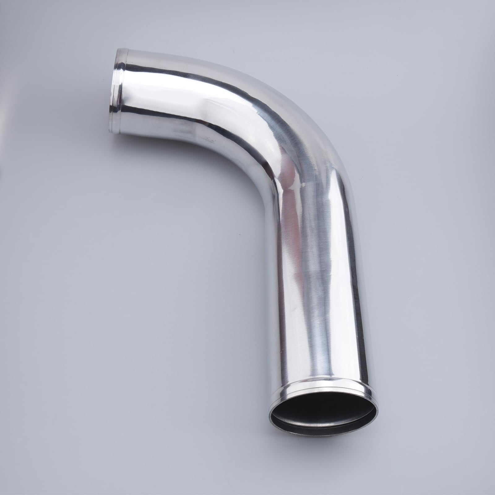 AC PERFORMANCE 3.5-inch OD aluminum intercooler pipe L-bend tube with 90-degree angle, showing smooth metallic surface and precise bend