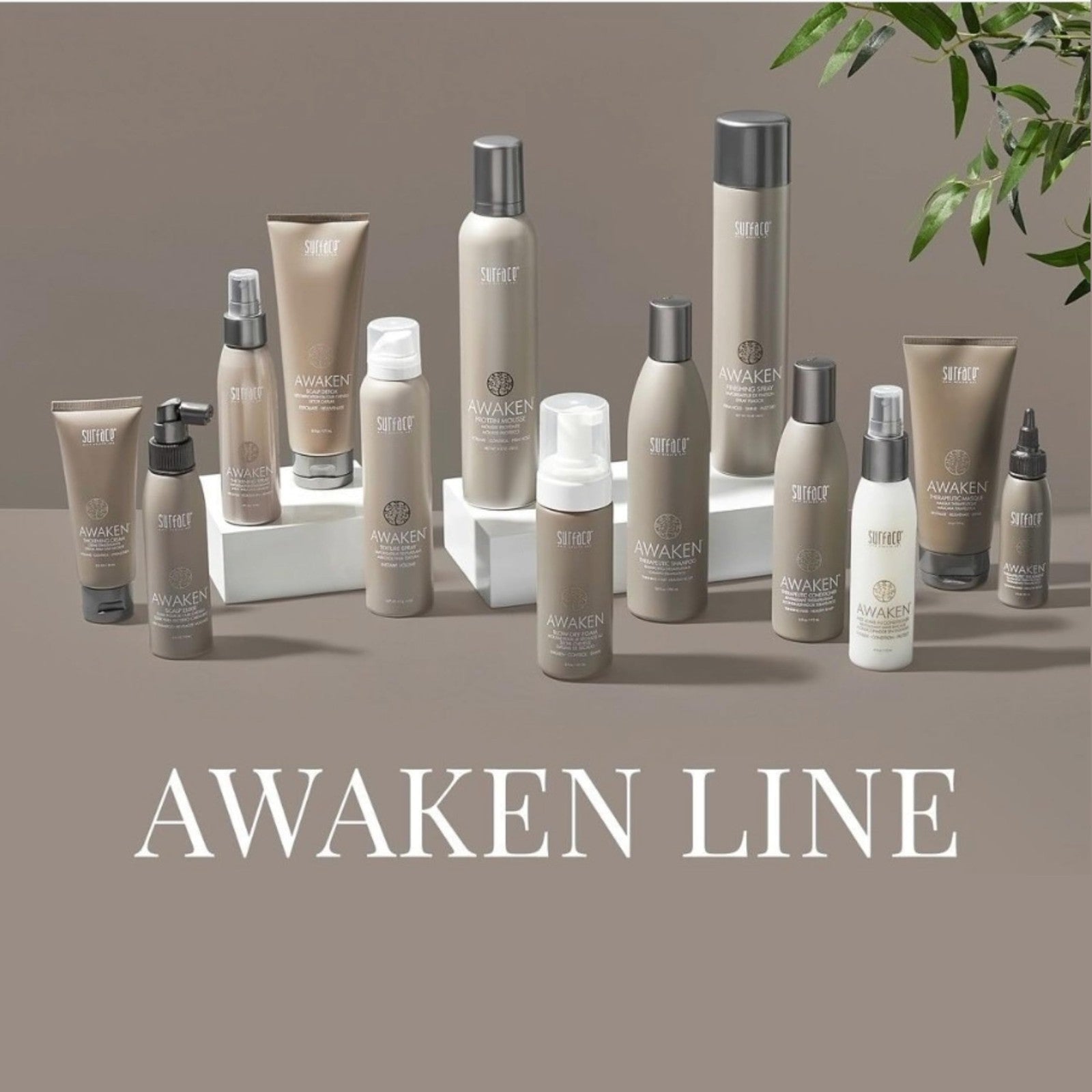 SURFACE Hair Awaken Thickening Blow Dry Foam showing the product bottle with pump dispenser, designed to protect and strengthen fine, fragile hair.