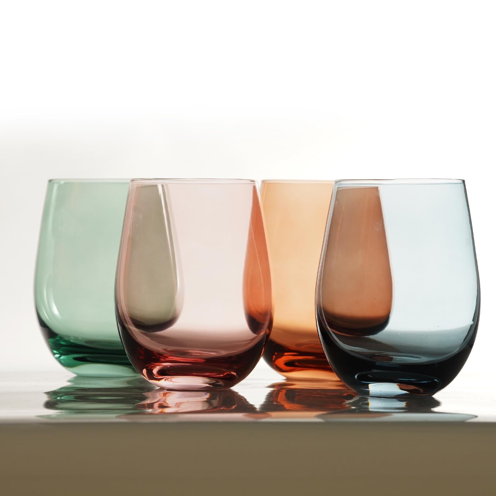 Set of four Gnimihz colored stemless wine glasses, 18-ounce capacity, designed for red or white wine, with vibrant tinted glass.
